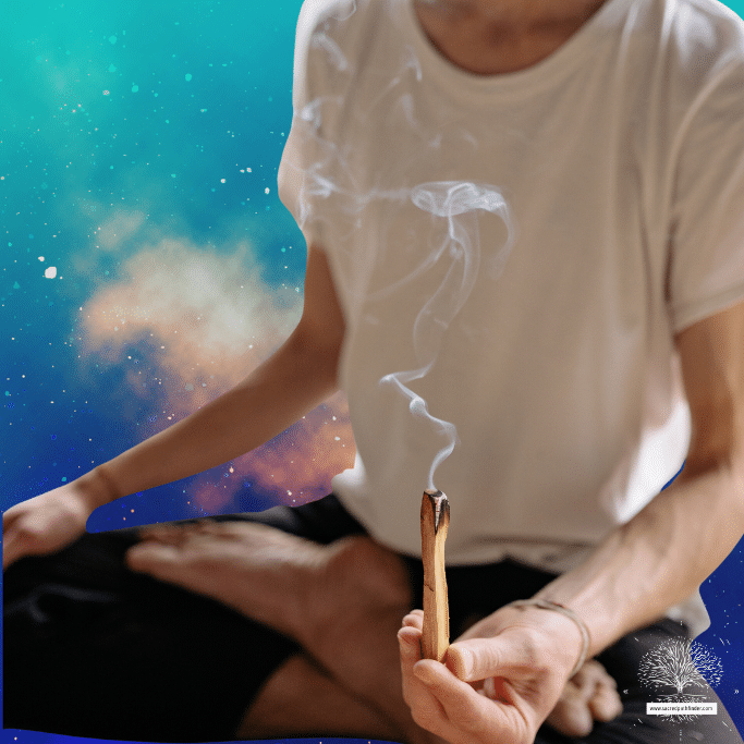 Photo of a person holding a smoldering stick of palo santo in front of a space background.