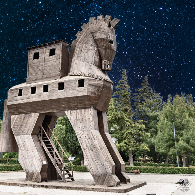 Photo of the Trojan horse in front of a night sky. 