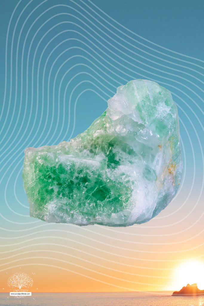 Photo of green aventurine in front of a sunset background.