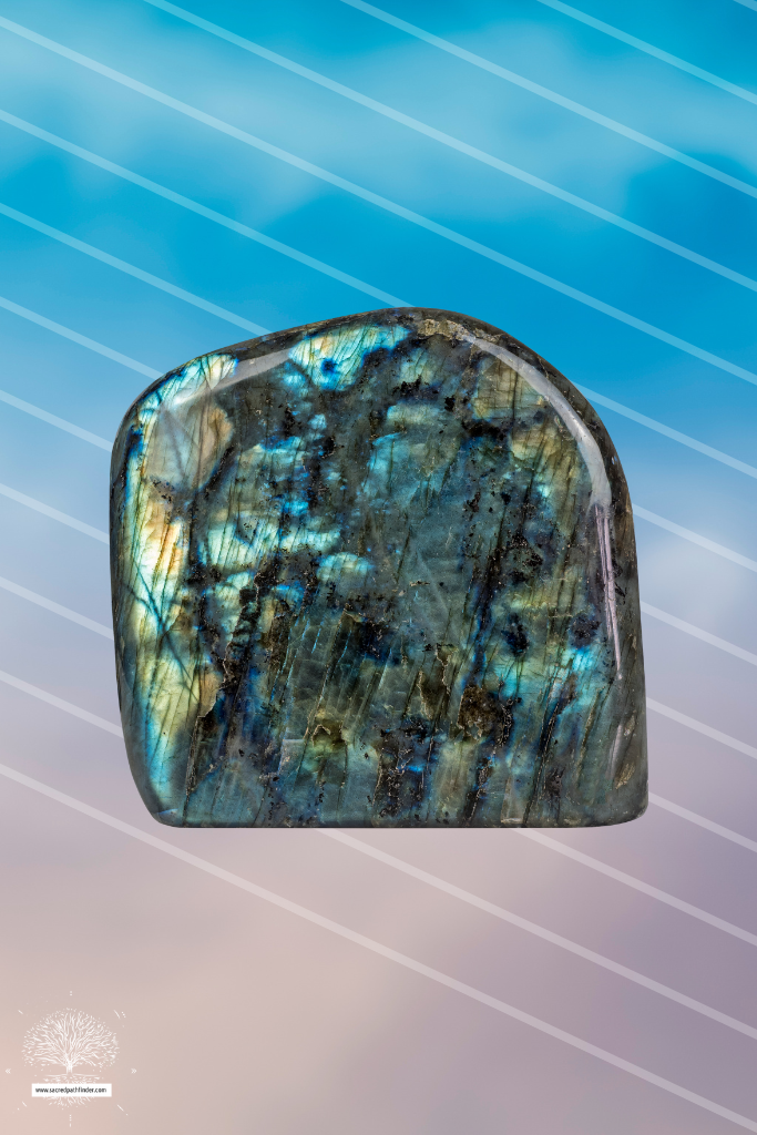 Photo of labradorite stone in front of a sky background. 