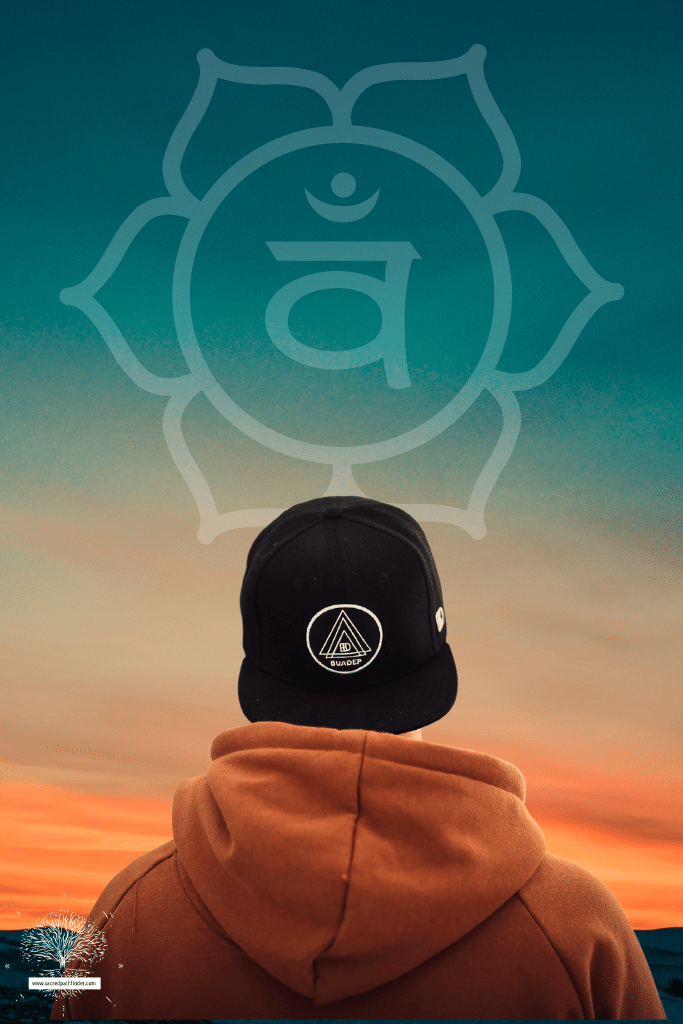 Photo of the back of a person in front a a sunset and the sacral chakra symbol