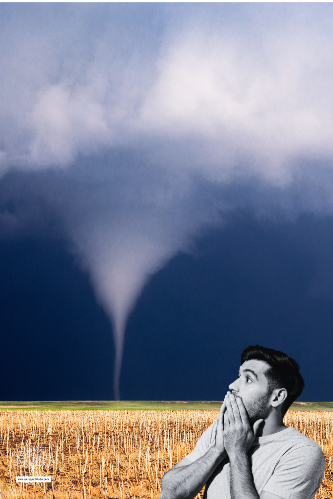 Photo of a man making a scared face. The photo of the man is in black and white. In the background is a tornado on a prairie, and is in color. 